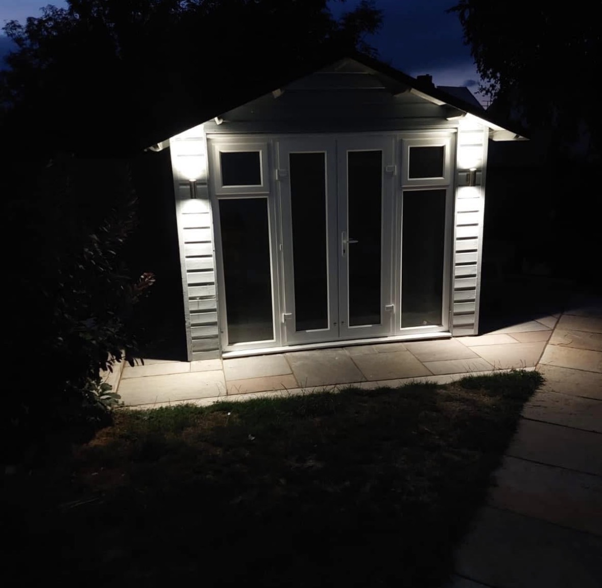 Garden room exterior lighting installed by J Burton Electrical, lit up at night